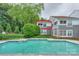 Sparkling community pool with sun loungers and lush surrounding greenery at 765 Southwest Dr, Davidson, NC 28036