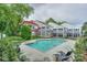 Community pool and home exterior featuring a screened porch and patio at 765 Southwest Dr, Davidson, NC 28036