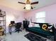 Cozy bedroom with a modern black desk, comfortable green sofa, and decorative accents at 7820 Elm Tree Ln, Charlotte, NC 28227