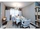 Cozy dining room featuring natural light, a modern chandelier, and a neutral color palette at 7820 Elm Tree Ln, Charlotte, NC 28227