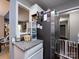 Kitchen area near the stainless refrigerator and white cabinets offering practical storage at 7820 Elm Tree Ln, Charlotte, NC 28227