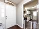 Entryway view showing the kitchen with white cabinets and stainless steel appliances at 7820 Elm Tree Ln, Charlotte, NC 28227