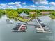 Beautiful aerial view of the community waterfront with boat slips, clubhouse, and lake access at 7822 Village Harbor Dr, Cornelius, NC 28031