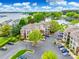 Aerial view of apartments with parking lot and lake at 7822 Village Harbor Dr, Cornelius, NC 28031
