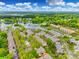 Aerial view showcasing the community layout, pool, and lake access at 7822 Village Harbor Dr, Cornelius, NC 28031