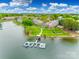 Aerial view of apartments on the water with a dock at 7822 Village Harbor Dr, Cornelius, NC 28031