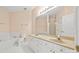 Bright bathroom features double sinks, white cabinetry, a soaking tub, and a glass shower, offering spa-like luxury at 7822 Village Harbor Dr, Cornelius, NC 28031