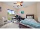 Bedroom with ceiling fan and view of the lake at 7822 Village Harbor Dr, Cornelius, NC 28031
