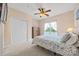 Bedroom featuring a water view, double closets, and a ceiling fan for a bright and airy feel at 7822 Village Harbor Dr, Cornelius, NC 28031