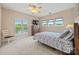 Bright bedroom with scenic views, comfortable carpet, and ample natural light streaming through multiple windows at 7822 Village Harbor Dr, Cornelius, NC 28031