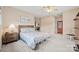 Comfortable bedroom offering a ceiling fan, cozy carpet, and multiple entryways to the home and bathroom at 7822 Village Harbor Dr, Cornelius, NC 28031