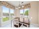 Sunlit dining area with lake views, complemented by a table with seating for four at 7822 Village Harbor Dr, Cornelius, NC 28031