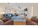 Spacious living room with a fireplace, ceiling fan, hardwood floors and comfortable seating at 7822 Village Harbor Dr, Cornelius, NC 28031