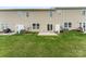 Spacious backyard featuring a well-kept lawn, concrete patio, and partial fence for privacy at 832 Summerlake Dr, Fort Mill, SC 29715