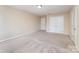 Spacious bedroom featuring neutral carpeting and closet doors at 832 Summerlake Dr, Fort Mill, SC 29715