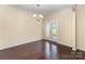 Bright dining room with natural light, hardwood floors, and chandelier lighting at 832 Summerlake Dr, Fort Mill, SC 29715