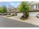 Attractive townhome with stone facade, two-car garage, and well-maintained front yard at 832 Summerlake Dr, Fort Mill, SC 29715