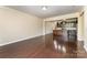 Spacious living room with gleaming hardwood floors, opening to a modern kitchen at 832 Summerlake Dr, Fort Mill, SC 29715