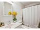 Clean bathroom featuring a white vanity, toilet, and shower with white shower curtain at 8322 Summerglen Cir, Charlotte, NC 28227