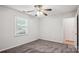 Neutral bedroom featuring carpeting and a window for natural light at 8322 Summerglen Cir, Charlotte, NC 28227