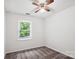 Simple bedroom offering natural light from a window at 8322 Summerglen Cir, Charlotte, NC 28227