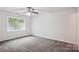 Spacious bedroom featuring ample natural light, neutral paint, and plush carpeting at 8322 Summerglen Cir, Charlotte, NC 28227