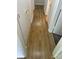 Long hallway featuring wood-like floors and access to several rooms at 8322 Summerglen Cir, Charlotte, NC 28227