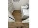 Laundry room with shelving, wood-like floors, and modern white washer and dryer at 8322 Summerglen Cir, Charlotte, NC 28227