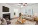 Cozy living room with fireplace, plush seating, and natural light, creating a warm and inviting atmosphere at 8322 Summerglen Cir, Charlotte, NC 28227