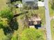Aerial view of a well-maintained property featuring a trampoline and fenced yard and mature trees at 834 Murphy St, Kannapolis, NC 28081