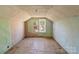 Unfinished attic space featuring a large window and pitched ceilings at 834 Murphy St, Kannapolis, NC 28081