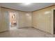 Medium sized room with light walls, view to a bathroom, and carpeting at 834 Murphy St, Kannapolis, NC 28081
