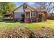Charming brick home with mature landscaping and a covered parking area at 834 Murphy St, Kannapolis, NC 28081