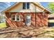 Exterior view of a brick house featuring a two-story section with dormer windows at 834 Murphy St, Kannapolis, NC 28081