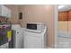 Functional laundry room with washer, dryer, and water heater at 834 Murphy St, Kannapolis, NC 28081