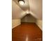 Finished attic with wood floors, neutral paint, and ceiling fans at 9113 Oak Bluff Ct, Waxhaw, NC 28173