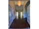 Inviting foyer with hardwood floors, a chandelier and an arched doorway leading to the living space at 9113 Oak Bluff Ct, Waxhaw, NC 28173