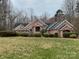 Charming single-story brick home with well-manicured landscaping and inviting curb appeal at 9113 Oak Bluff Ct, Waxhaw, NC 28173