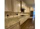Gourmet kitchen featuring granite countertops, custom cabinets, and stainless steel appliances at 9113 Oak Bluff Ct, Waxhaw, NC 28173
