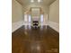 Spacious living room with hardwood floors, fireplace and decorative molding at 9113 Oak Bluff Ct, Waxhaw, NC 28173