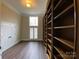 Office includes a wall of bookshelves, a window and hardwood floors at 9113 Oak Bluff Ct, Waxhaw, NC 28173