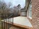 An open concrete patio with brick trim is attached to the side of the house at 9113 Oak Bluff Ct, Waxhaw, NC 28173