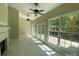 Bright sunroom with tile floors, large windows, and access to the outdoors at 9113 Oak Bluff Ct, Waxhaw, NC 28173