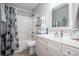 Cozy bathroom featuring a shower-tub combination, clean vanity and neutral decor at 1050 Emerson Dr, Mooresville, NC 28115
