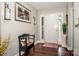 Bright foyer with a white front door, hardwood floors, and elegant decor at 1050 Emerson Dr, Mooresville, NC 28115