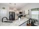 Bright kitchen featuring white cabinets, granite countertops, and stainless steel appliances at 1050 Emerson Dr, Mooresville, NC 28115