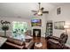 Spacious living room with vaulted ceilings, hardwood floors, and a cozy fireplace, perfect for entertaining at 1050 Emerson Dr, Mooresville, NC 28115