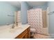 Cozy bathroom with a tub shower combo, wood vanity, and a light blue painted wall at 1097 Constitution Park Blvd, Rock Hill, SC 29732