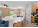 Open kitchen with modern appliances and island with breakfast bar at 1097 Constitution Park Blvd, Rock Hill, SC 29732