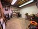 Unfinished basement with exposed ceiling, shelving, work bench and organization at 1224 Island Creek Dr, Troy, NC 27371